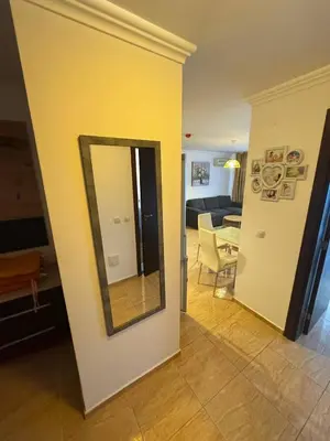 a mirror on a wall in a living room at Kombani 3 in Sveti Vlas