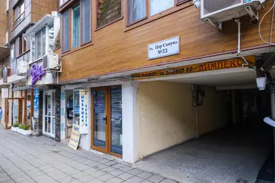 a building with a sign that reads the corner shop at Sam Centre Harmony 1-Bedroom in Burgas City