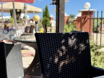 a black chair with a heart on the back of it at Carina Beach - Menada Apartments in Sunny Beach