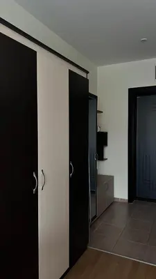 a room with two black doors and a mirror at Sunny Beach Fort Noks Orchid Apartment in Sunny Beach