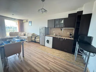 a living room with a kitchen and a living room with a kitchen and a living at Линоляни in Pomorie