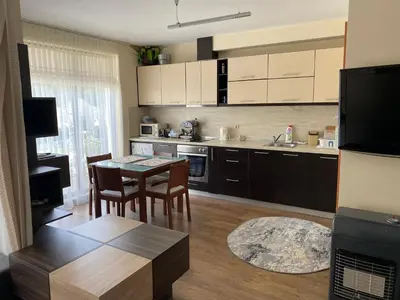 a kitchen with a table and chairs in a room at Luxury Studio B02 SB in Sunny Beach