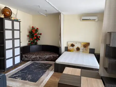 a bedroom with two beds and a christmas tree at Luxury Studio B02 SB in Sunny Beach