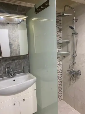 a bathroom with a sink and a shower at Къща за гости DOSH in Sozopol