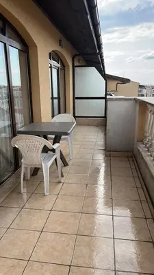 a patio with a table and chairs on a balcony at 1BD Apartment in Royal Sun Complex, Sunny Beach by Flat Mаnager in Sunny Beach