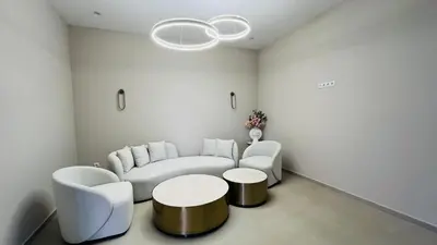 a living room with a couch and two chairs and a table at JADORE Secret Garden Panoramic Studio in Sunny Beach
