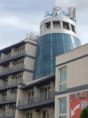 a building with a tower on top of it at Sol e Mar Sunny Beach in Sunny Beach