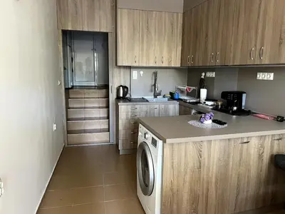 a kitchen with a washing machine in a kitchen at Central 1BR Apartment Near Cathedral in Varna City
