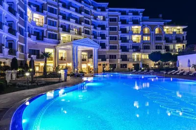 a large swimming pool in front of a building at night at 2-Bedroom Apartment in Villa Florence Boutique ApartHotel in Sveti Vlas