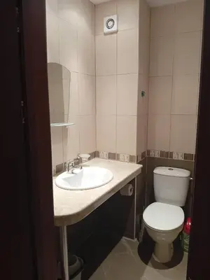 a bathroom with a sink and a toilet at Двустаен апартамент във Виго Панорама Несебър in Nesebar