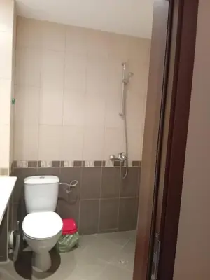 a bathroom with a toilet and a shower at Двустаен апартамент във Виго Панорама Несебър in Nesebar
