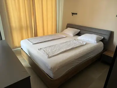a bed with two pillows on it in a bedroom at Apartment Victoria in Kraymorie