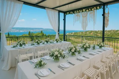 a table set up for a wedding with a view at Sea Sky House in Varna City