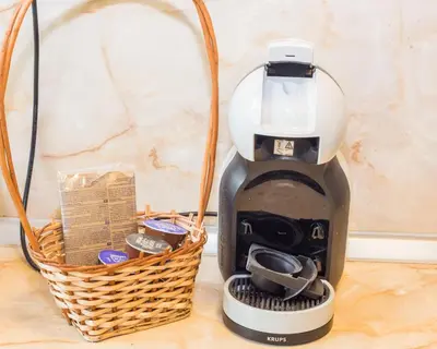 a coffee maker sitting next to a basket at Large 2 bedrooms Flat - TOP Center - in front of the Beach in Burgas City