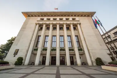 a tall building with columns on the front of it at Large 2 bedrooms Flat - TOP Center - in front of the Beach in Burgas City