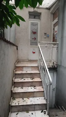 a set of stairs in a building with a door at Стая лидер хаус in Varna City