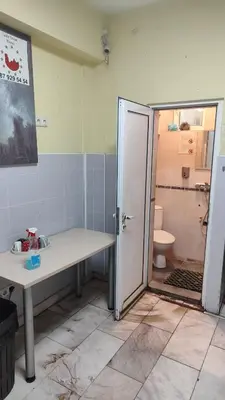 a bathroom with a sink and a toilet at Стая лидер хаус in Varna City