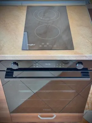 a stove top oven sitting on top of a counter at SeaSky SmartHome-Penthouse with private Parking in Burgas City