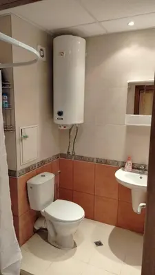 a bathroom with a toilet and a sink at Apartment Photinia in Byala