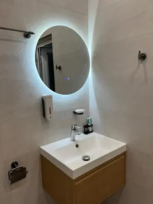 a bathroom with a sink and a mirror at Nearby the Sea- Elegant Retreat in Varna in Varna City