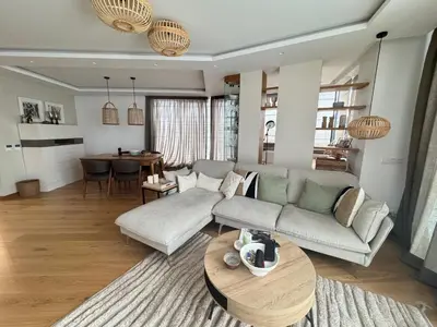 a living room with a couch and a table at Azure View in Burgas City