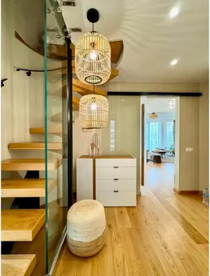 a living room with a staircase and a stool at Azure View in Burgas City