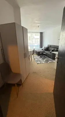 a living room with a couch and a chair at Atlantis Resort in Burgas City