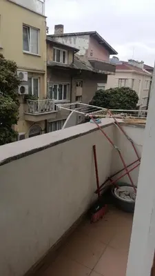 a view of a balcony with a broom at Апартамент център in Varna City
