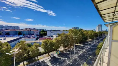 arial view of a city with trees and street lights at Комфорт и стиль - Апартамент с панорамой города in Burgas City