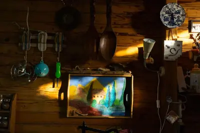 a tv in a room with a painting on the wall at Бунгала Гнездото Bungalows The Nest 1 in Lozenets