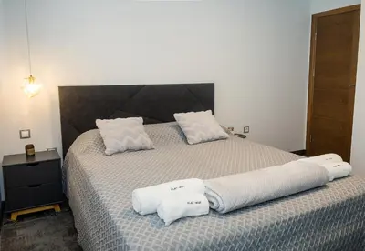 a bedroom with a bed with two towels on it at Cozy Flat with Two Bedrooms in Central Varna by Flat Mаnаger in Varna City