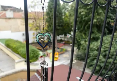 a heart shaped key hanging from a gate at Cozy Flat with Two Bedrooms in Central Varna by Flat Mаnаger in Varna City