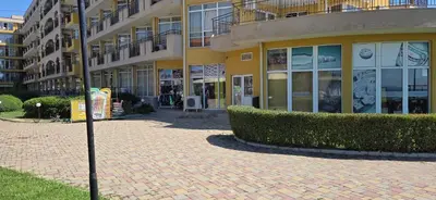 a building with a street sign in front of it at Studio F210 - Bulharsko in Aheloy