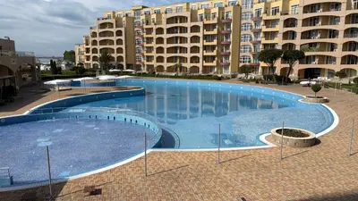 a large swimming pool in front of a large building at Studio F210 - Bulharsko in Aheloy