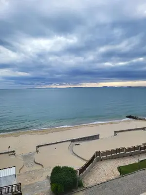 a beach with stairs leading down to the ocean at Garden of Eden studio in Sveti Vlas