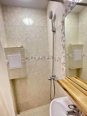 a bathroom with a shower with a toilet and a sink at 'The Conch' Room with Private Entrance and Bathroom in Burgas City