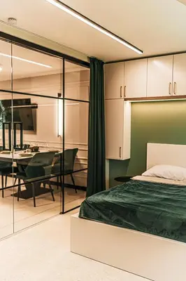 a bedroom with a bed and a dining room at The Loft - Parking - Washer&Dryer - Port view - Balcony in Burgas City