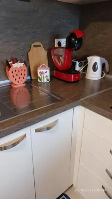 a kitchen counter with a red mixer on a counter top at Апартамент Феличита in Byala