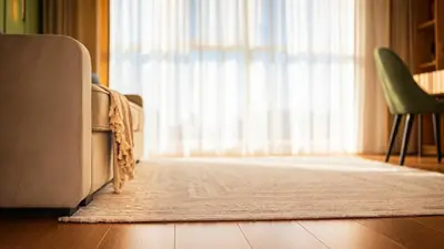 a living room with a couch and a large window at Harmony Delux Apartment -Free parking in Burgas City