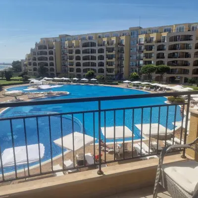 a view of a swimming pool from a balcony at Charming Studio at the Seaside in Aheloy