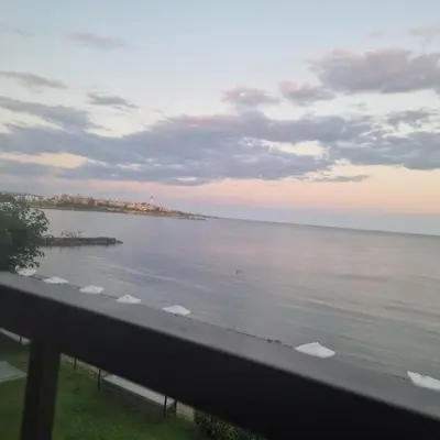 a view of the ocean from the balcony of a condo at Charming Studio at the Seaside in Aheloy