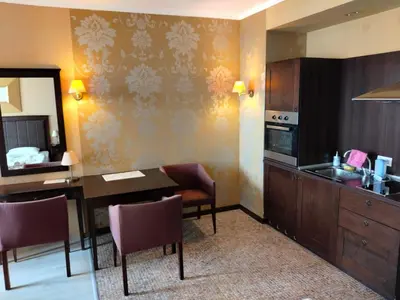 a room with a kitchen and a dining room at Studio Royal Beach Barcello in Sunny Beach