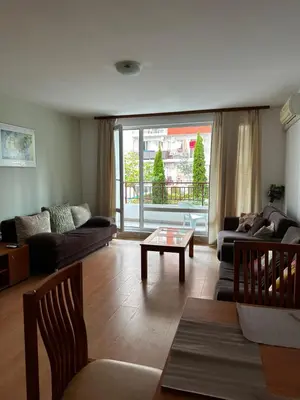 a living room with a couch and a table at Have a Good Rest Apartments in Sveti Vlas