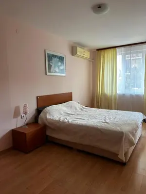 a bedroom with a large bed and a window at Have a Good Rest Apartments in Sveti Vlas