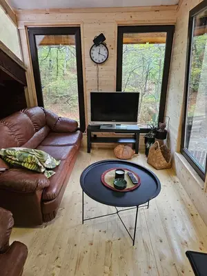 a living room with a couch and a coffee table at Apartment With 2 Bedrooms - Magic Woods