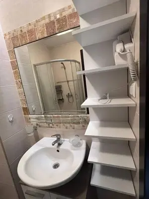 a bathroom with a sink and a mirror at Coastera Group Cascadas 8 in Sunny Beach