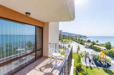 a balcony with chairs and a view of the ocean at Premier Fort Sands Resort - Full Board in Sunny Beach