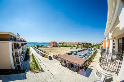 an aerial view of a city with cars parked in a parking lot at Premier Fort Club Hotel - Full Board in Sunny Beach