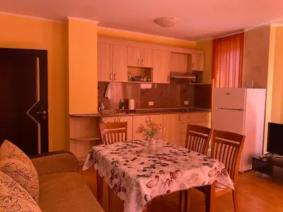 a kitchen with a table with a table cloth on it at Sunny Home 2 in Sunny Beach