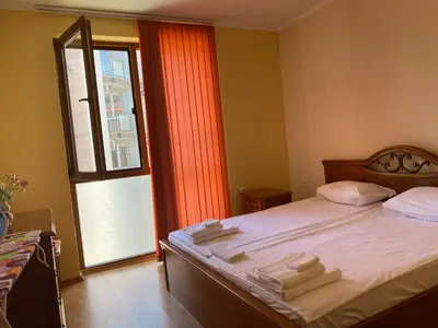 a bedroom with a bed with towels on it at Sunny Home 2 in Sunny Beach
